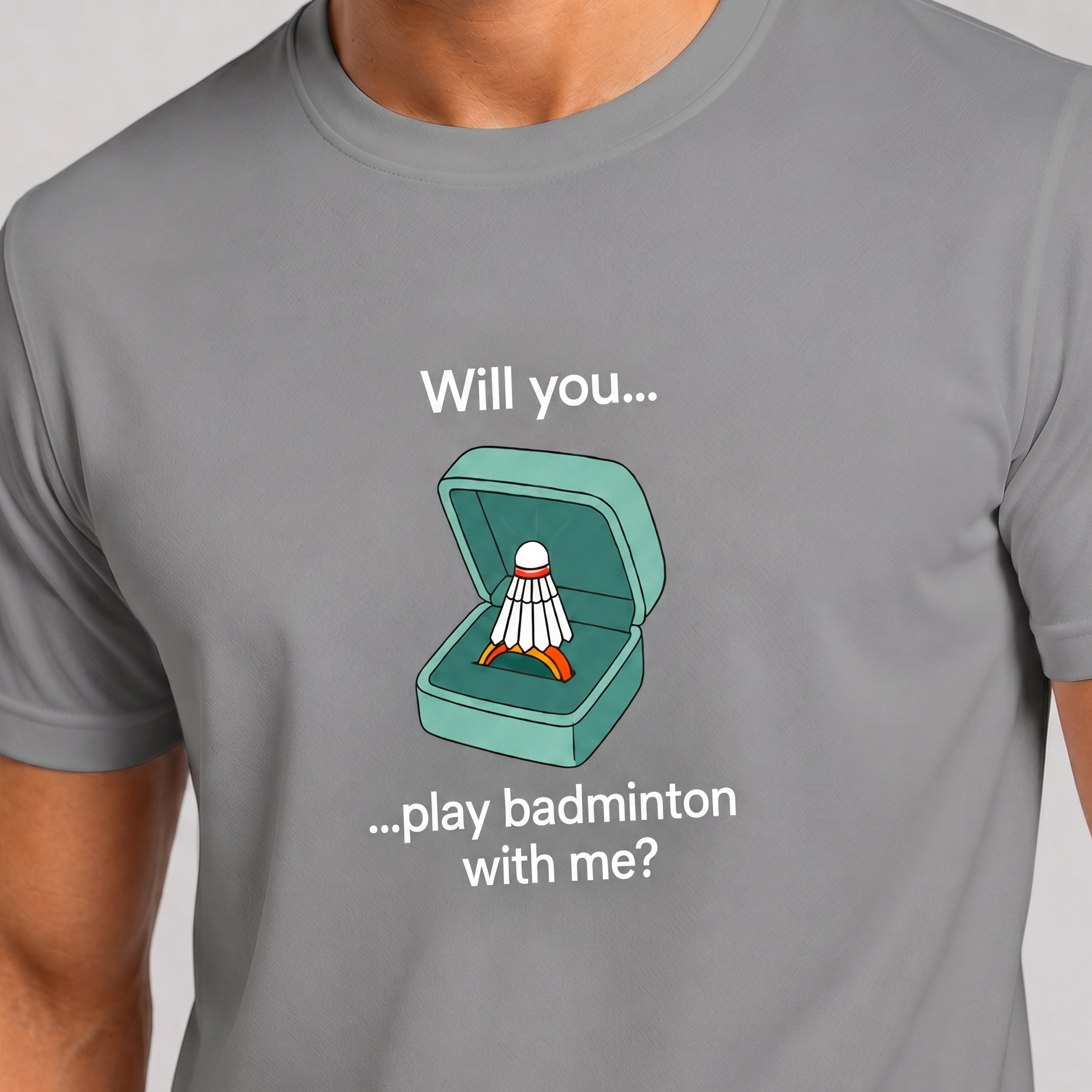 Gray t-shirt with a badminton-themed graphic and text on a plain background