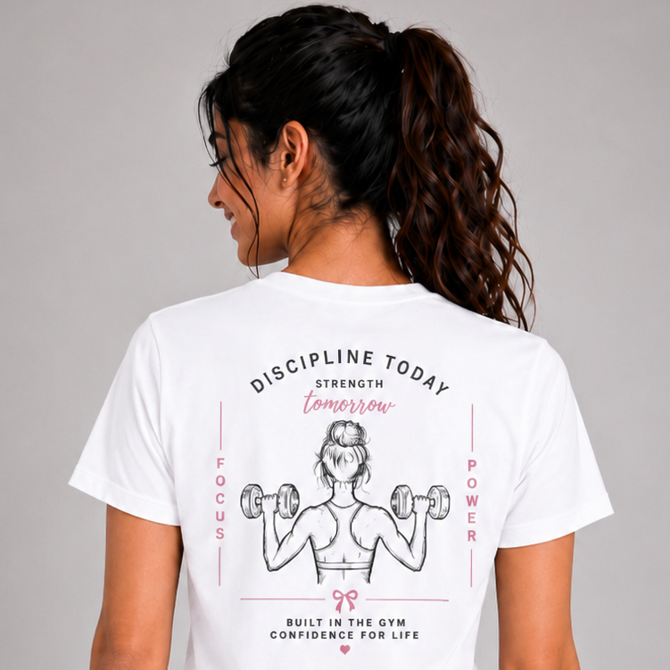 Person wearing a white t-shirt with a graphic design on the back against a gray background
