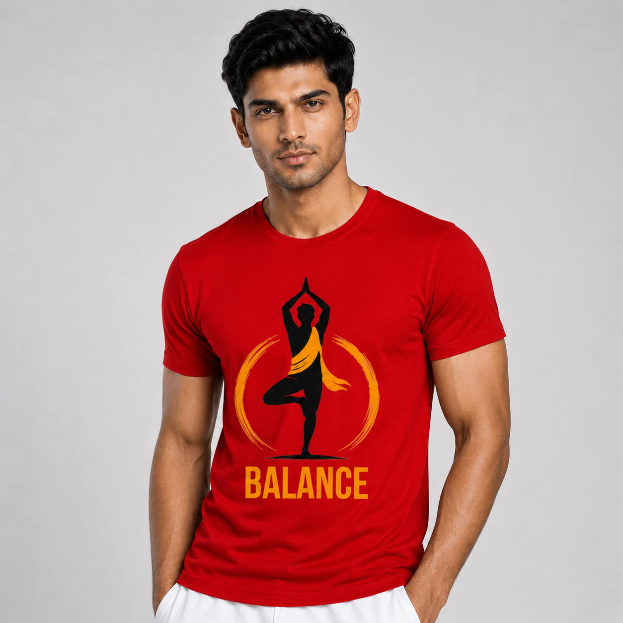 Man wearing a red t-shirt with a yoga graphic and 'BALANCE' text on a gray background