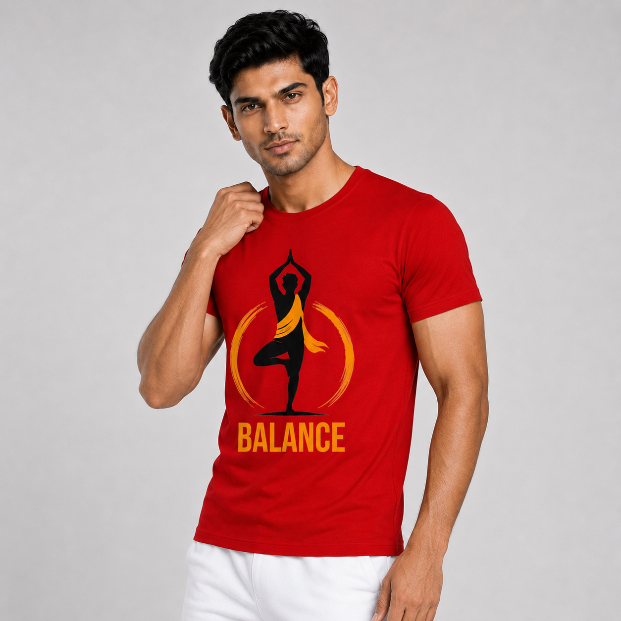 Man wearing a red t-shirt with a balance logo on a gray background