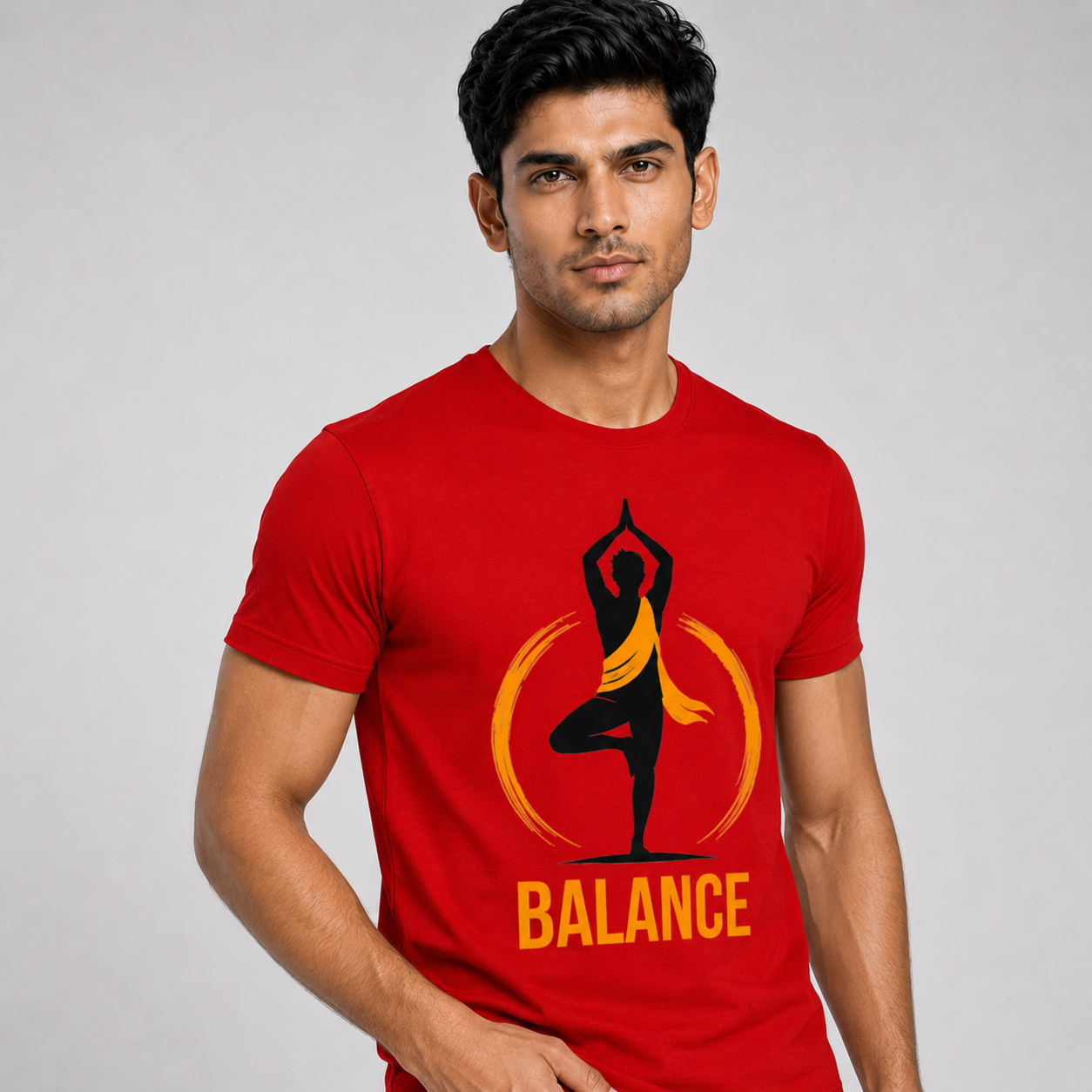 Man wearing a red t-shirt with a yoga pose graphic and 'BALANCE' text on a gray background