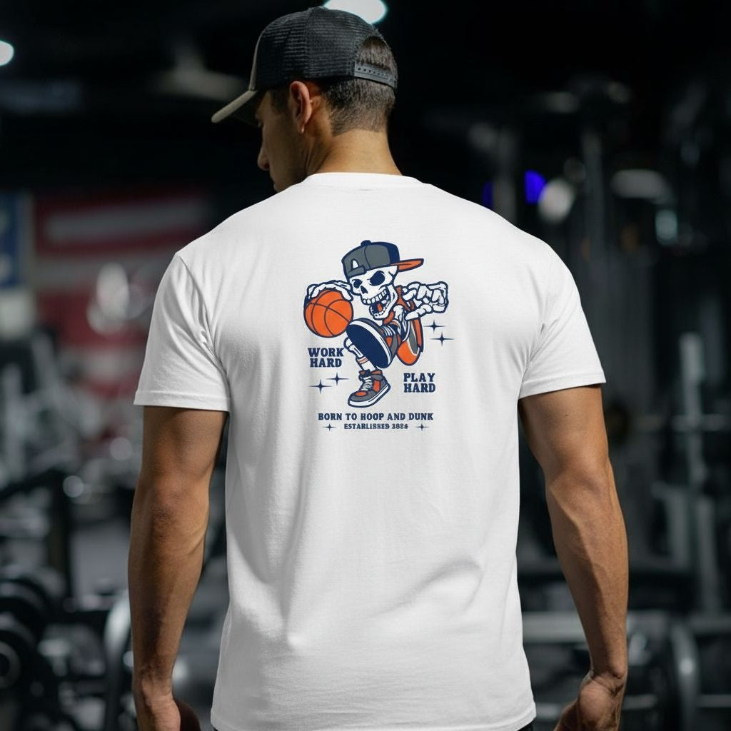 Person wearing a white t-shirt with a graphic design on the back, standing in an indoor setting.