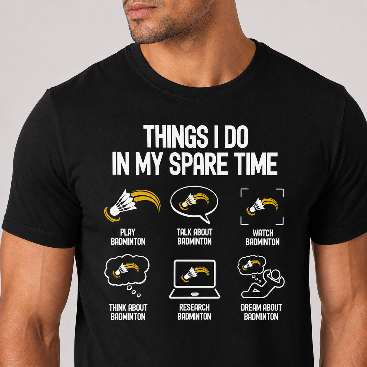 Black t-shirt with humorous badminton-themed text and icons on a plain background
