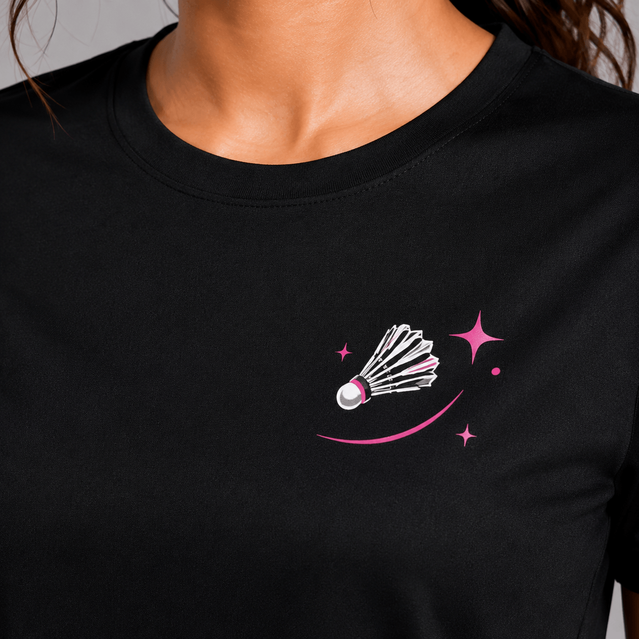 Black t-shirt with a badminton shuttlecock design on a plain background