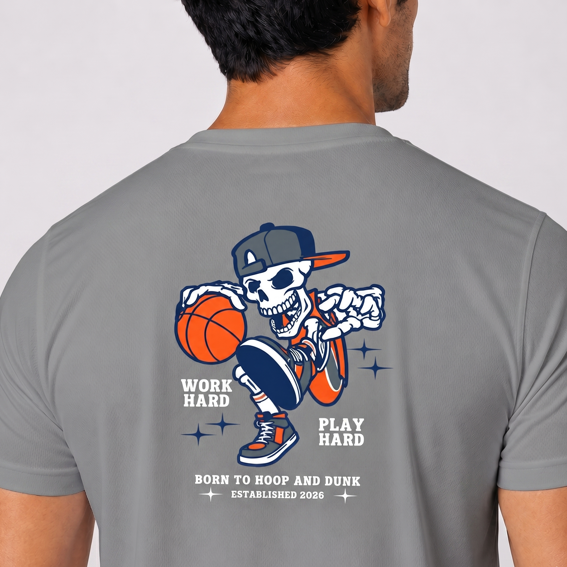 Gray t-shirt with a skeleton playing basketball graphic and text on the back