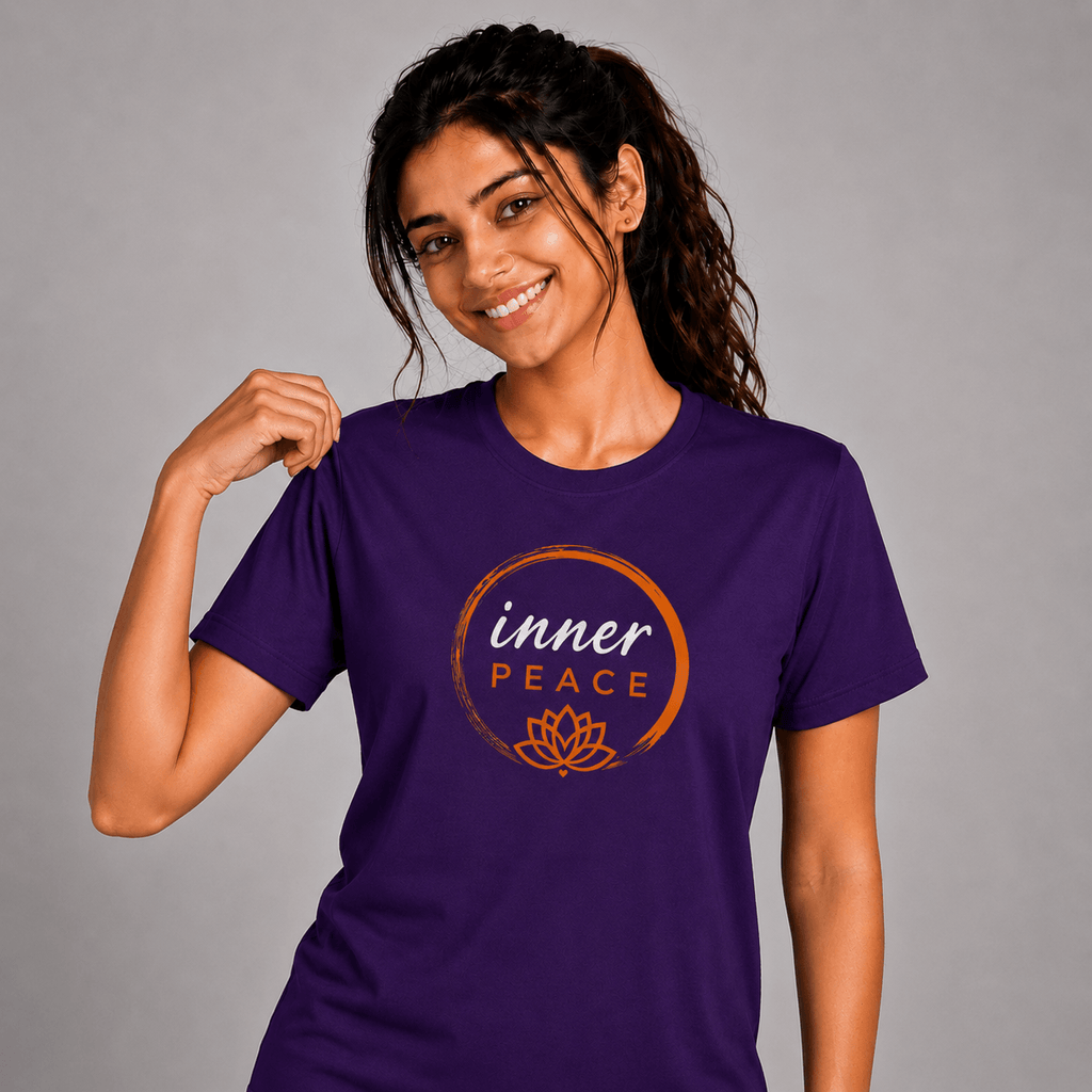 Woman wearing a purple yoga  t-shirt with 'inner PEACE' design on a gray background