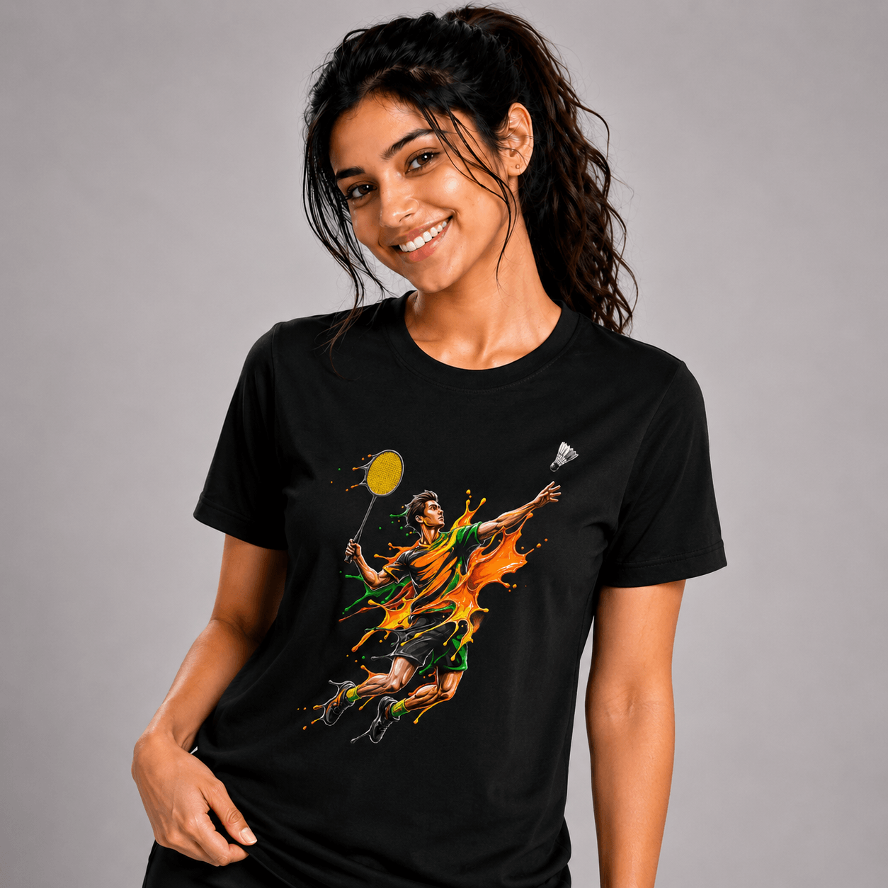 Woman wearing a black t-shirt with a graphic design on a gray background