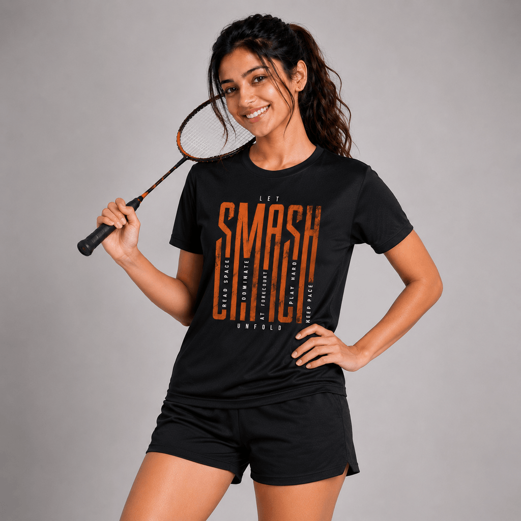 Woman wearing a black t-shirt with 'SMASH' text, holding a badminton racket on a gray background