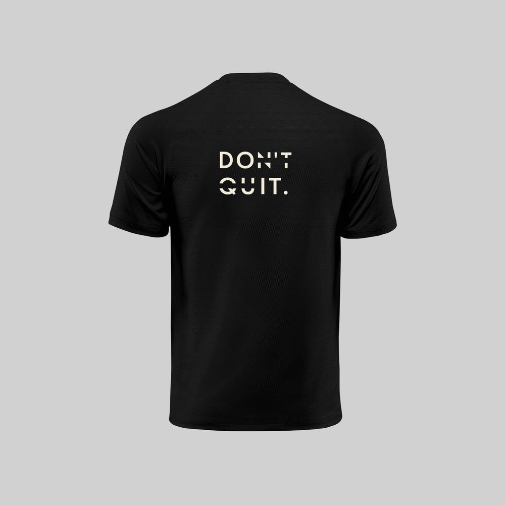 Black t-shirt with 'DON'T QUIT.' text on the back against a gray background