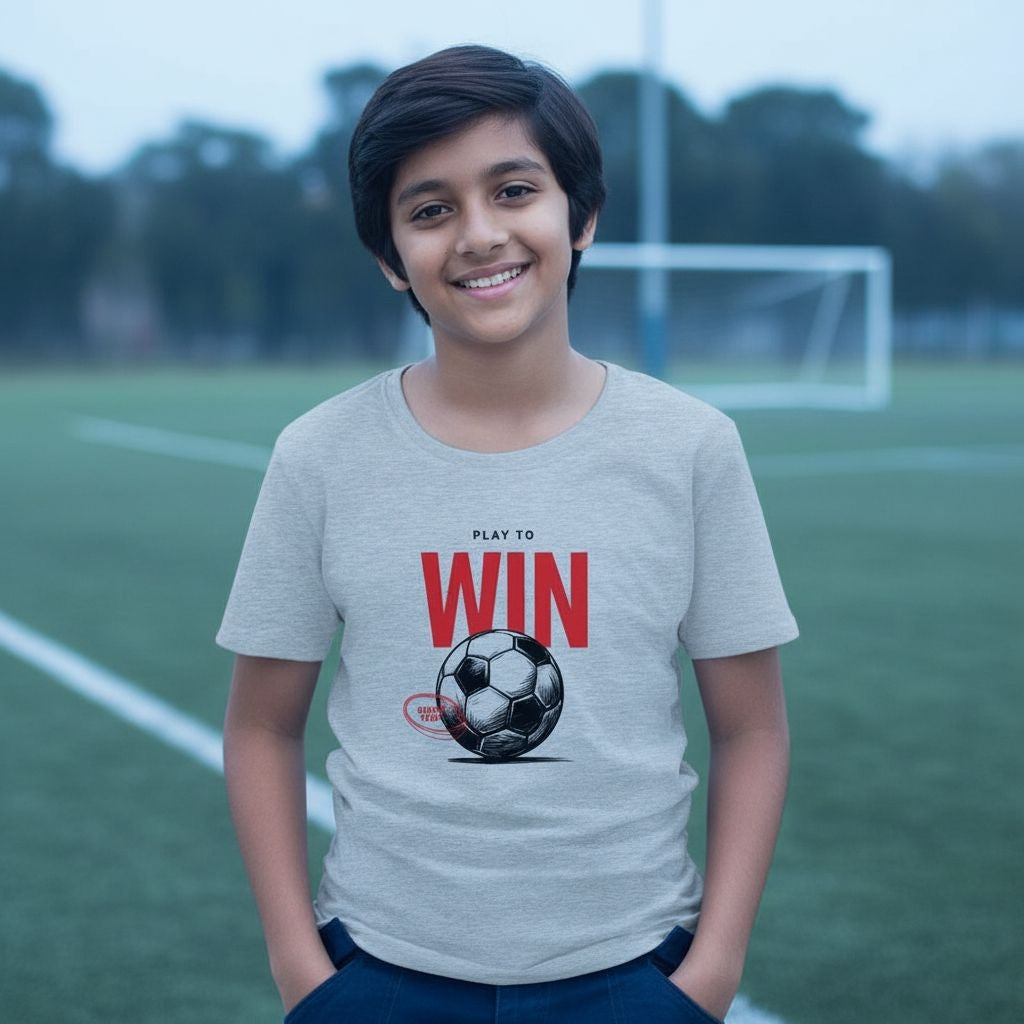 Person wearing a t-shirt with a soccer ball and text on a sports field