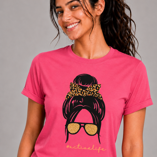 Woman wearing a pink t-shirt with a graphic design on a gray background