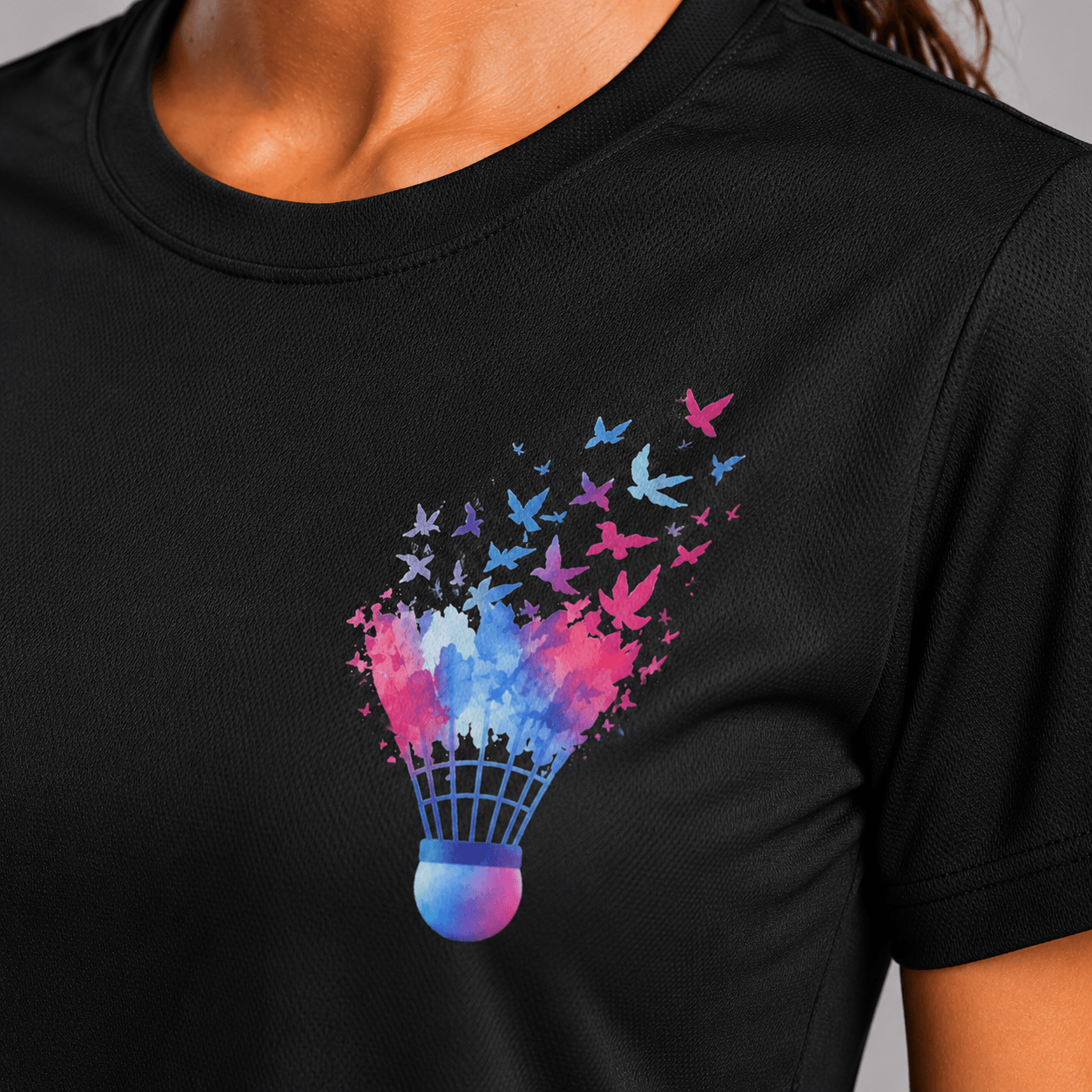 Black t-shirt with a colorful badminton shuttlecock design featuring butterflies.