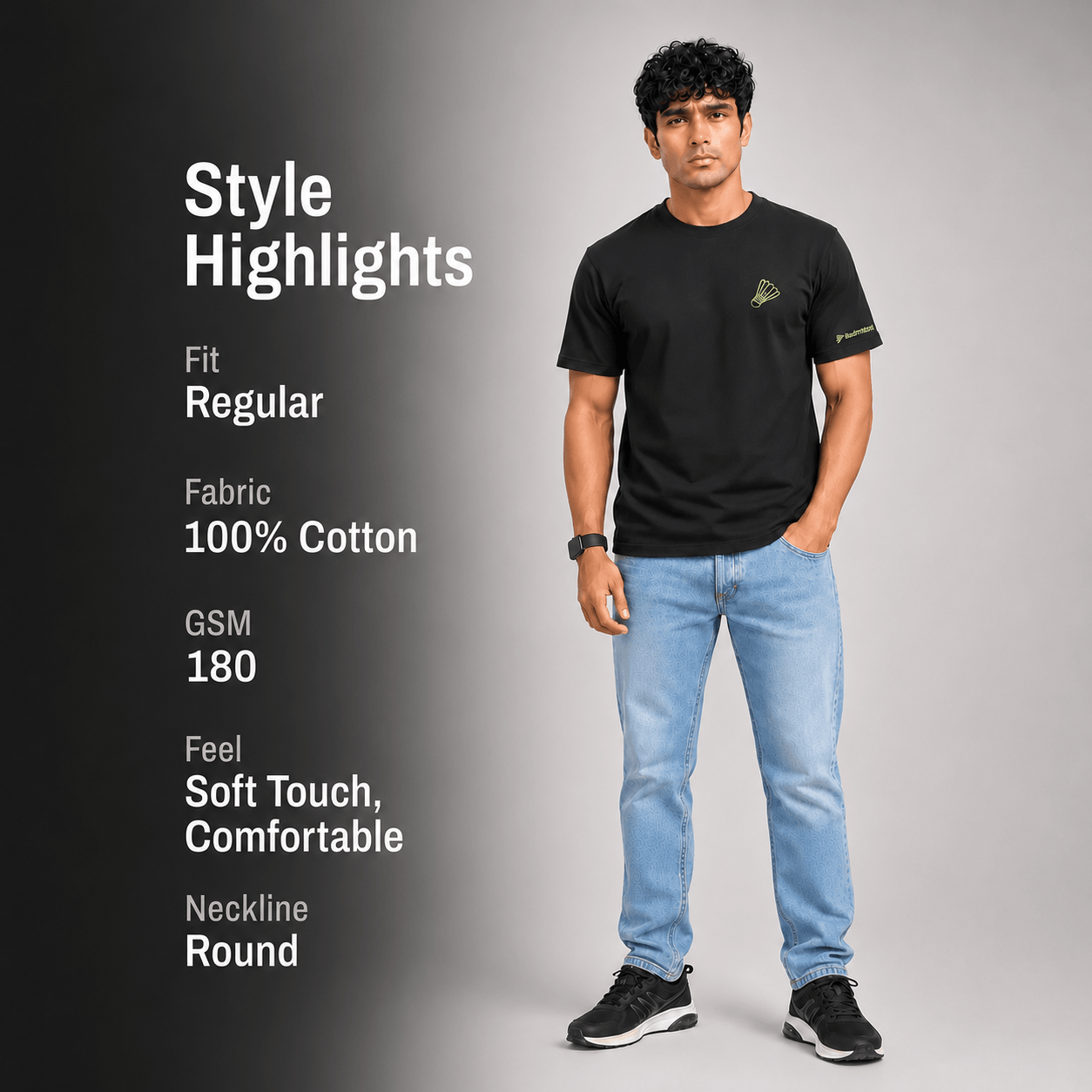A man modeling a black short-sleeve t-shirt with light blue jeans and black sneakers, standing against a gray gradient background. On the left, white text reads 'Style Highlights' with details: Fit Regular, Fabric 100% Cotton, GSM 180, Feel Soft Touch, Comfortable, Neckline Round.